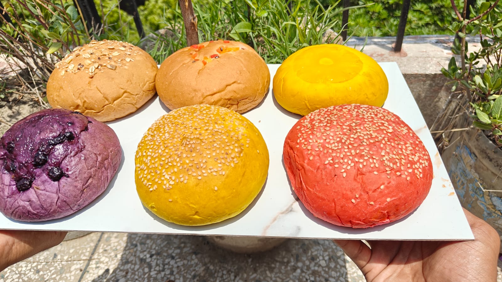 Tray of colourful artisan buns